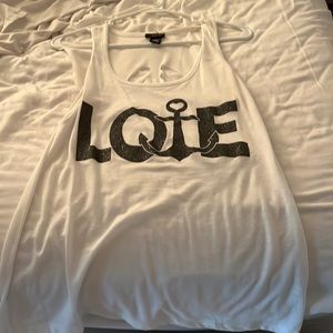 Rue 21 brand. Size XL. White tank top. Cut out in back